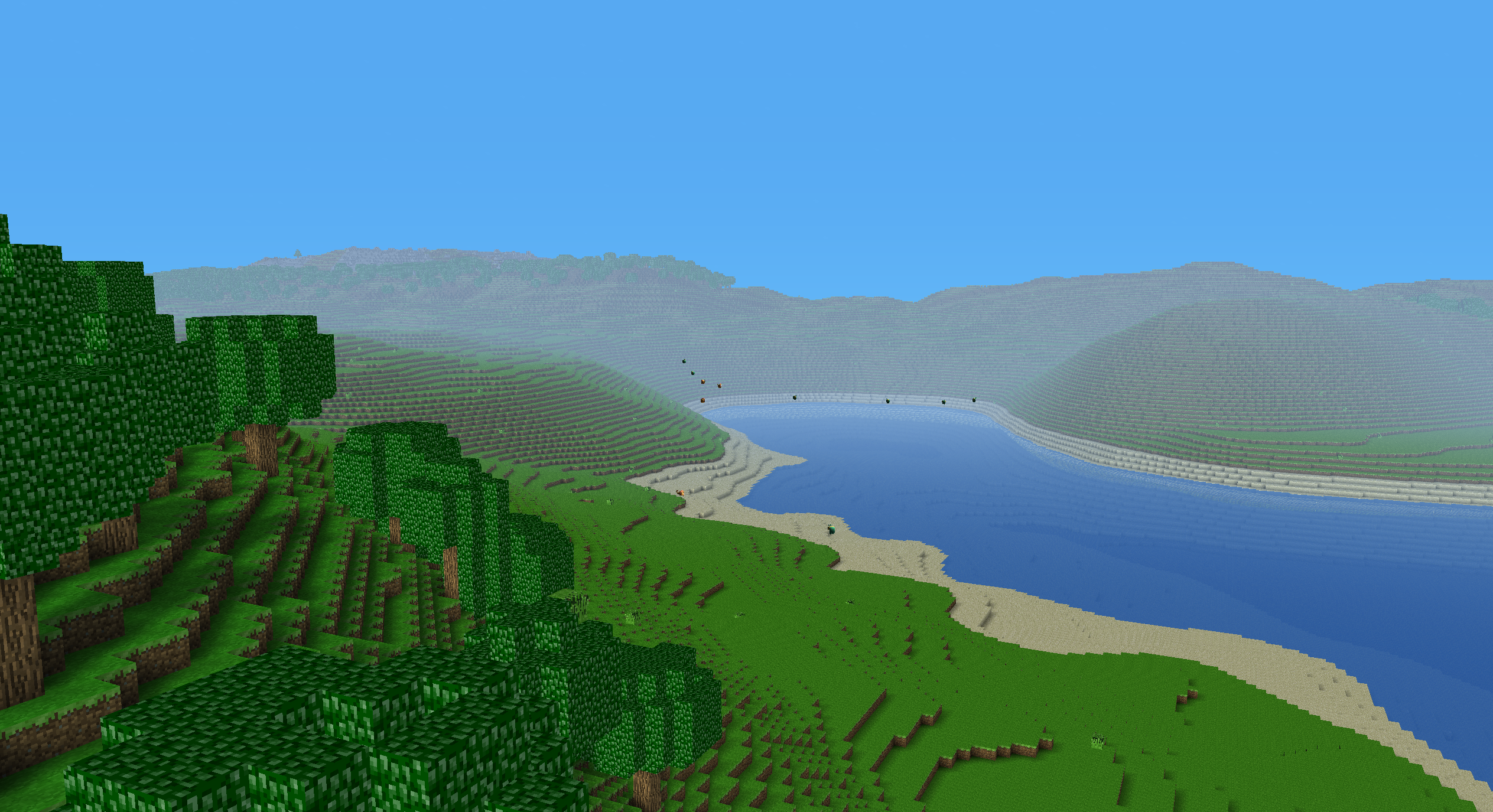 Grassland coast with beach and mountains