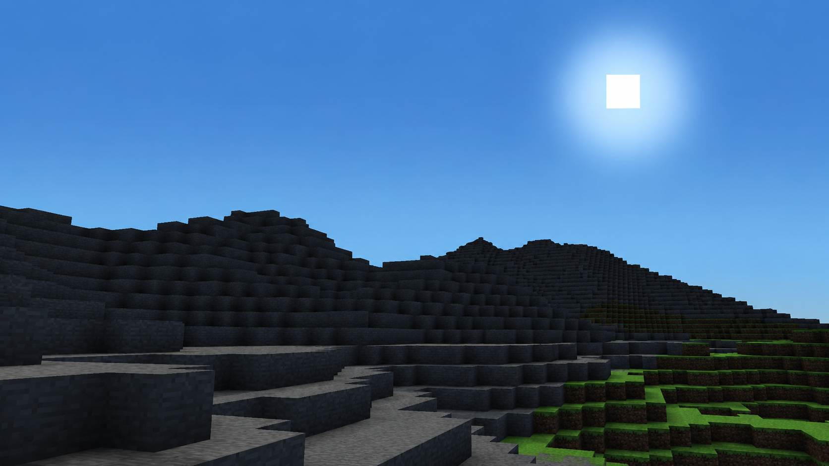 Mountain at dusk with sun bloom